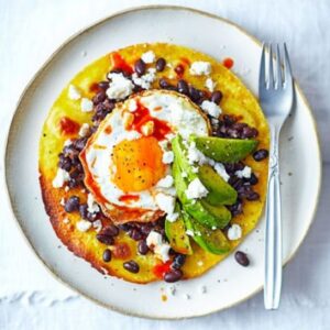 Egg, beans, and avocado tostada