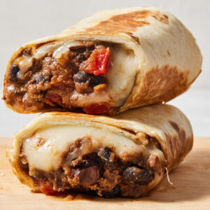 Stack of two bean burritos.