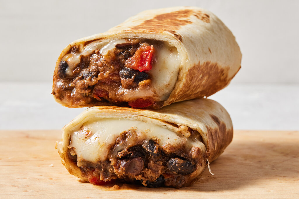 Stack of two bean burritos.