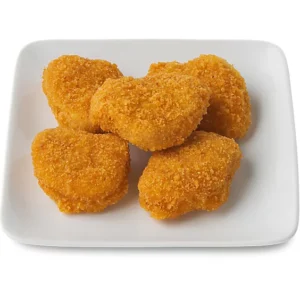 Golden chicken nuggets on plate