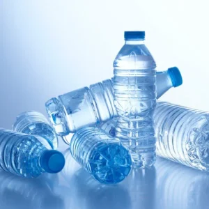Clear plastic water bottles on table