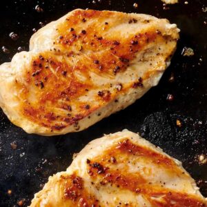 Two seared chicken breasts