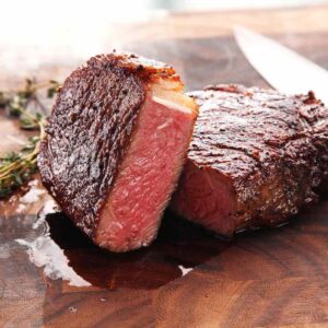 Juicy steak with thyme and knife