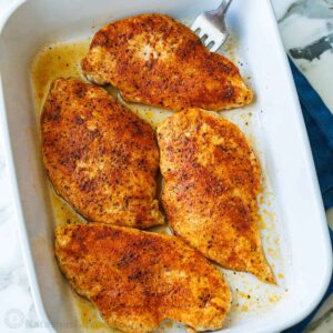 Spicy baked chicken breasts in dish