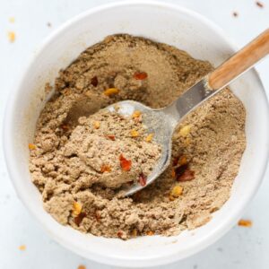 Spice blend in white bowl.
